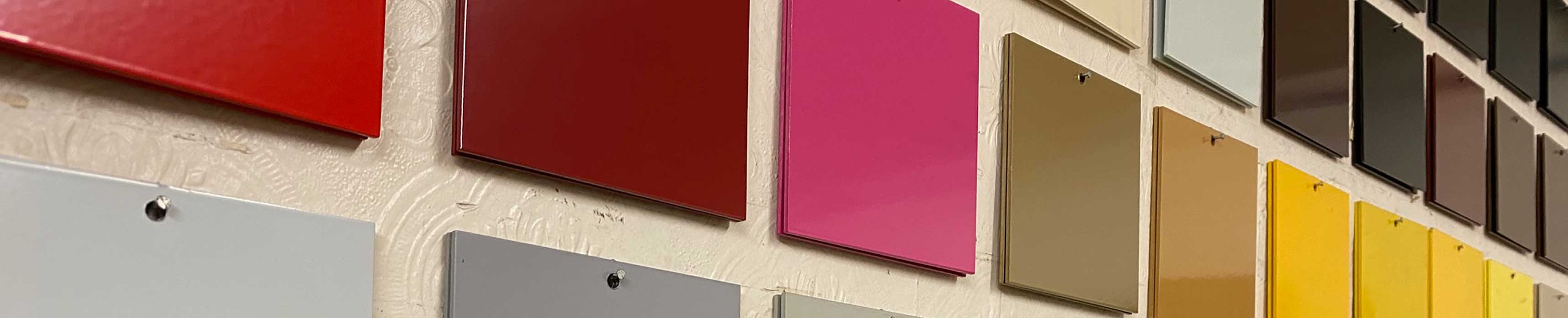 Powder coating colour chips hanging on a wall