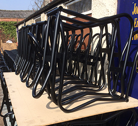 Powder coated metal frames drying outside