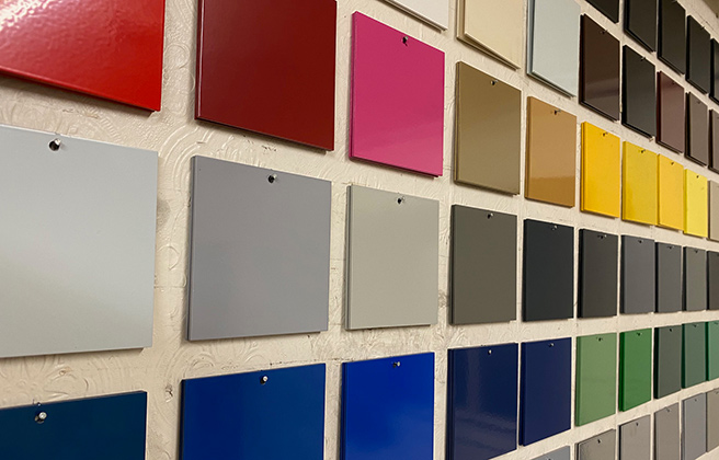 Powder coated colour chips hanging on a wall