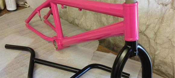 Pink and black powder coated bike frame